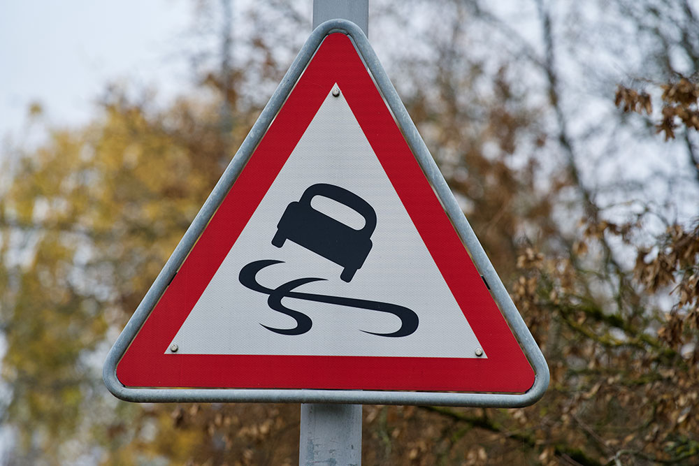 Slippery road sign